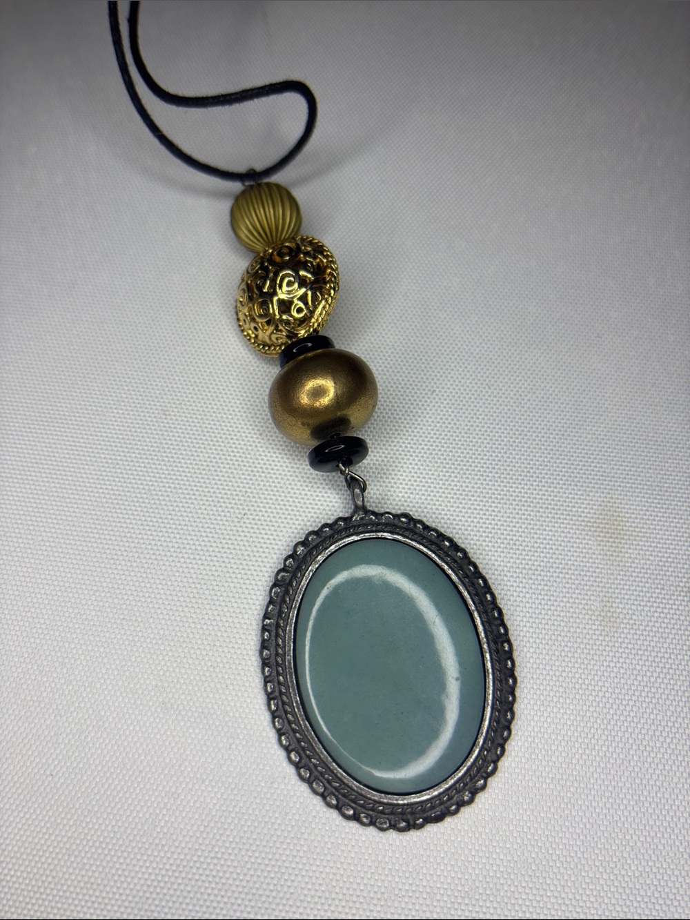 Long corded blue Cabachon antique style necklace